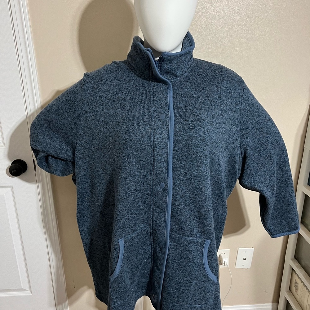 Catherine’s zippered/snapped blue 4X sweater jacket with pockets.